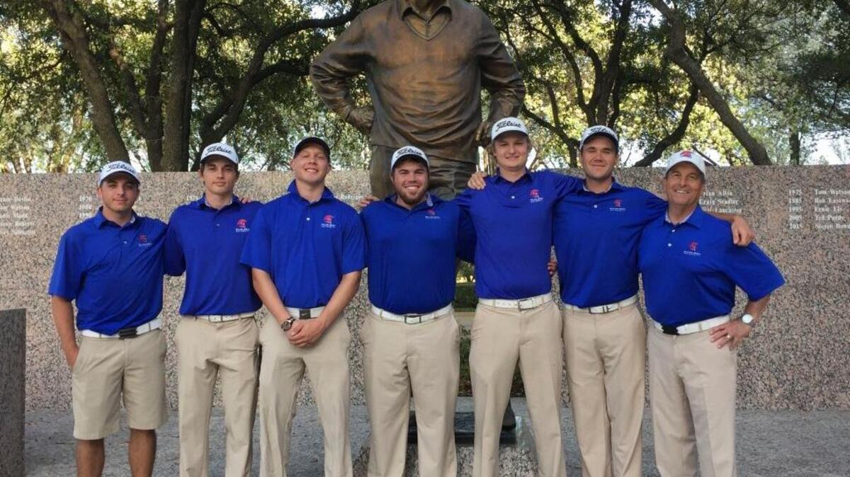 The William Jessup golf team poses in front of the Byron Nelson statue at TPC Las Colinas in Irving, Texas. From left to right, Dale Thomas, Johnnie Greco, Clark Pietromonaco, Arick Koeth, Dylan Neal, Jonathan Goswitz and coach Tim Hovancsek.