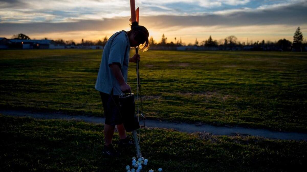 Third year golfer Hugo Yeh after golf practice at Hiram Johnson High School on Tuesday, Feb. 9, 2016, in Sacramento, Calif. “Other players always get mad when they mess up,” said Yeh, who has one birdie and “three or four pars” in two years. “I just giggle. I think, ‘Why are you mad?’ “
