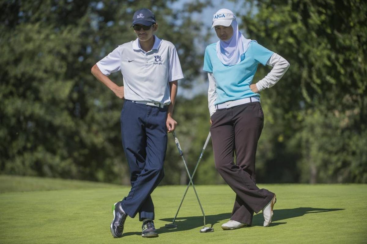 Noor Ahmed and her brother Yusuf, 15, wait to putt during the First Tee of Greater Sacramento’s 26th Annual Jr/Sr Funvitational on Friday at Haggin Oaks Golf Complex in Sacramento. Noor Ahmed credits the First Tee for her development from a bullied child to a dynamic young woman who earned the honor in April of speaking at the Congressional Breakfast in Washington, D.C.