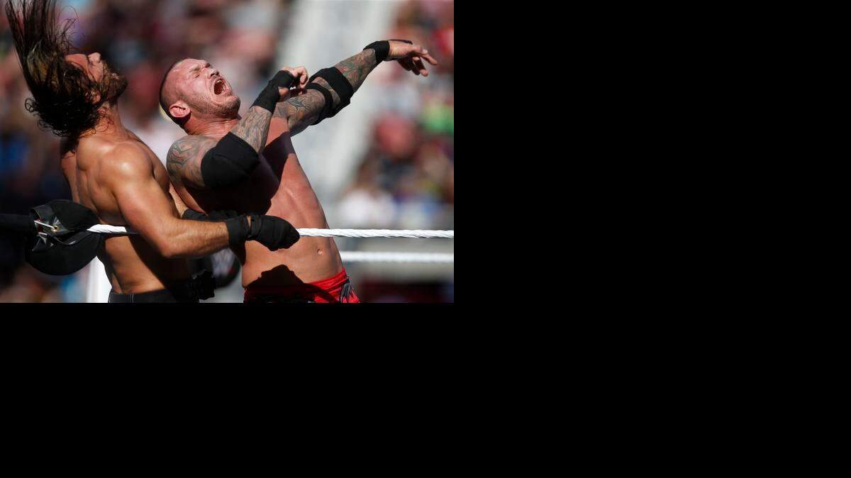 WWE’s Randy Orton, right, hits Seth Rollins during WrestleMania at Levi’s Stadium on Sunday, March 29, 2015 in Santa Clara, Calif.
