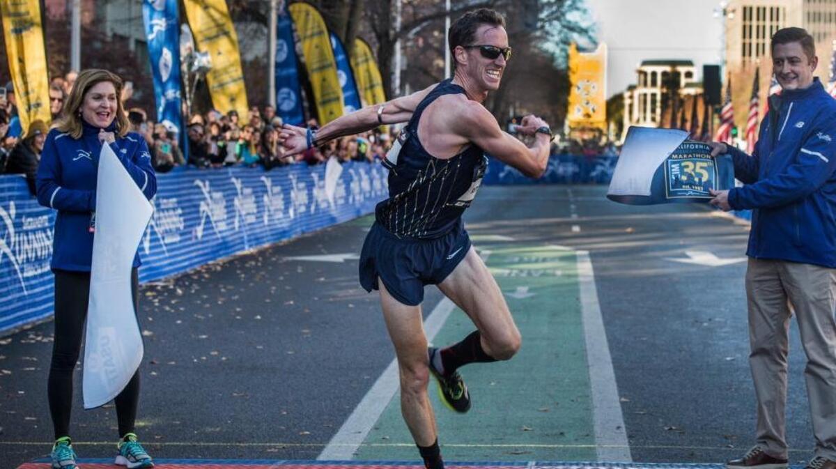 Tim Ritchie crosses the finish line to win the USATF Marathon Championships held in conjunction with the California International Marathon (CIM) in Sacramento, Calif., on Sunday, Dec. 3, 2017. Ritchie did not emerge as the leader until mile 23 after marathon debutante Parker Stinson led most of the way.