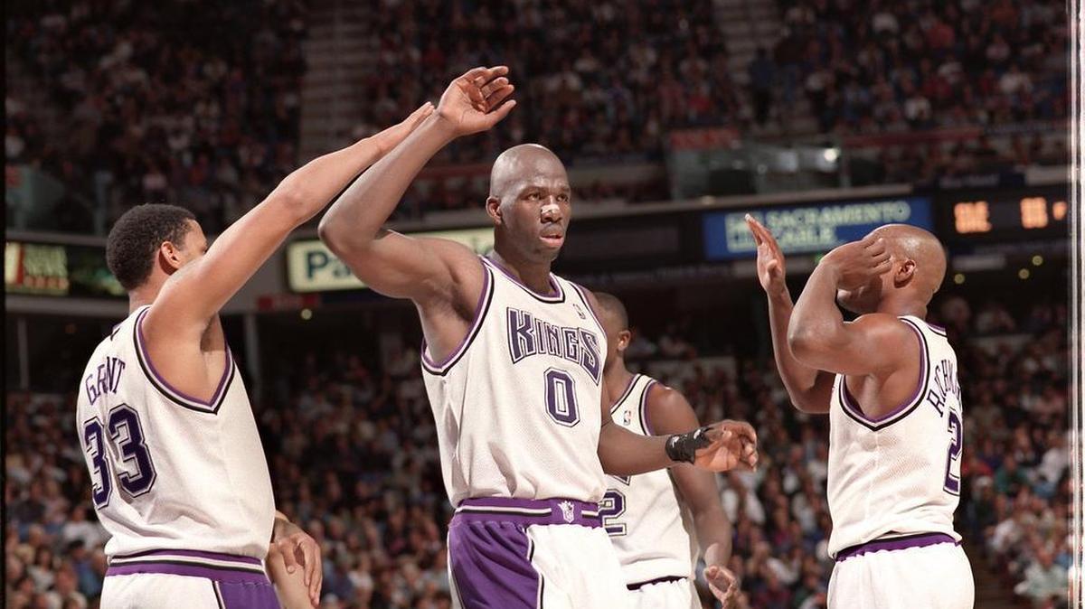 KINGS’ CONNECTION: Olden Polynice was drafted eighth overall by the Chicago Bulls in 1987, and immediately traded to Seattle. In 82 games, he averaged 4.1 points and 4.0 rebounds. He played five seasons for Seattle, two for Utah, three for the Los Angeles Clippers and two for the Detroit Pistons. He was traded to the Kings in February 1980 and played five seasons with the Kings. He averaged 18.7 points and 15.2 rebounds. Polynice (0) gets congratulations from teammates Brian Grant (33) and Mitch Richmond (2) during an NBA basketball game against the Minnesota Timberwolves at Arco Arena, Nov. 3, 1995 in Sacramento.