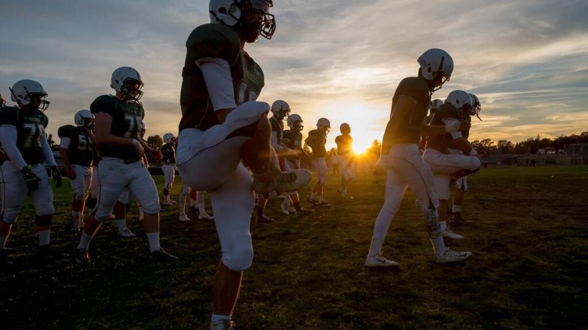 The Rio Americano High School football team warms up before its road game against El Camino at Del Campo High School on Friday, Oct. 7, 2016. The host Eagles beat the Raiders 37-0.