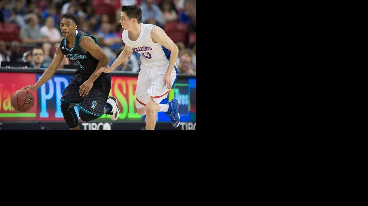 
Folsom Bulldogs Alec Andrews (33) puts defensive pressure on Sheldon Huskies Elishja Duplechan (1) during the San Joaquin Section Division I Championship at Sleep Train Arena on Saturday, March 7, 2015, in Sacramento.
