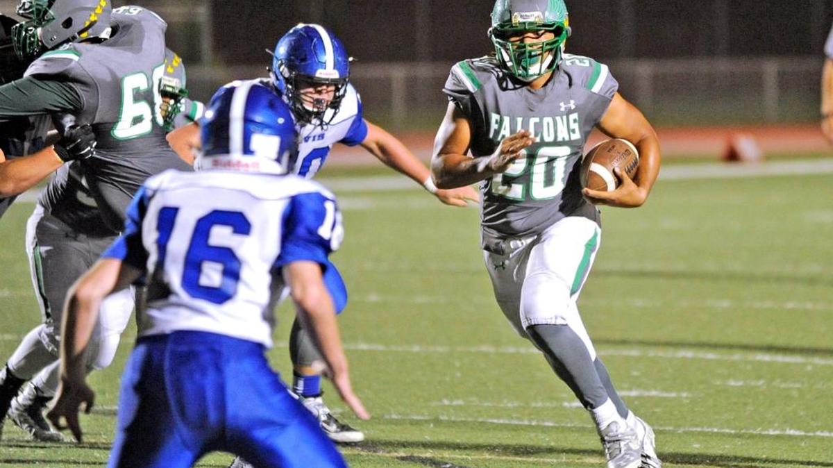 
Fullback Clarence Pierson surges through a hole for a big gain during River Valley’s 43-21 victory against Davis on Sept. 4 at Falcon Stadium in Yuba City.
