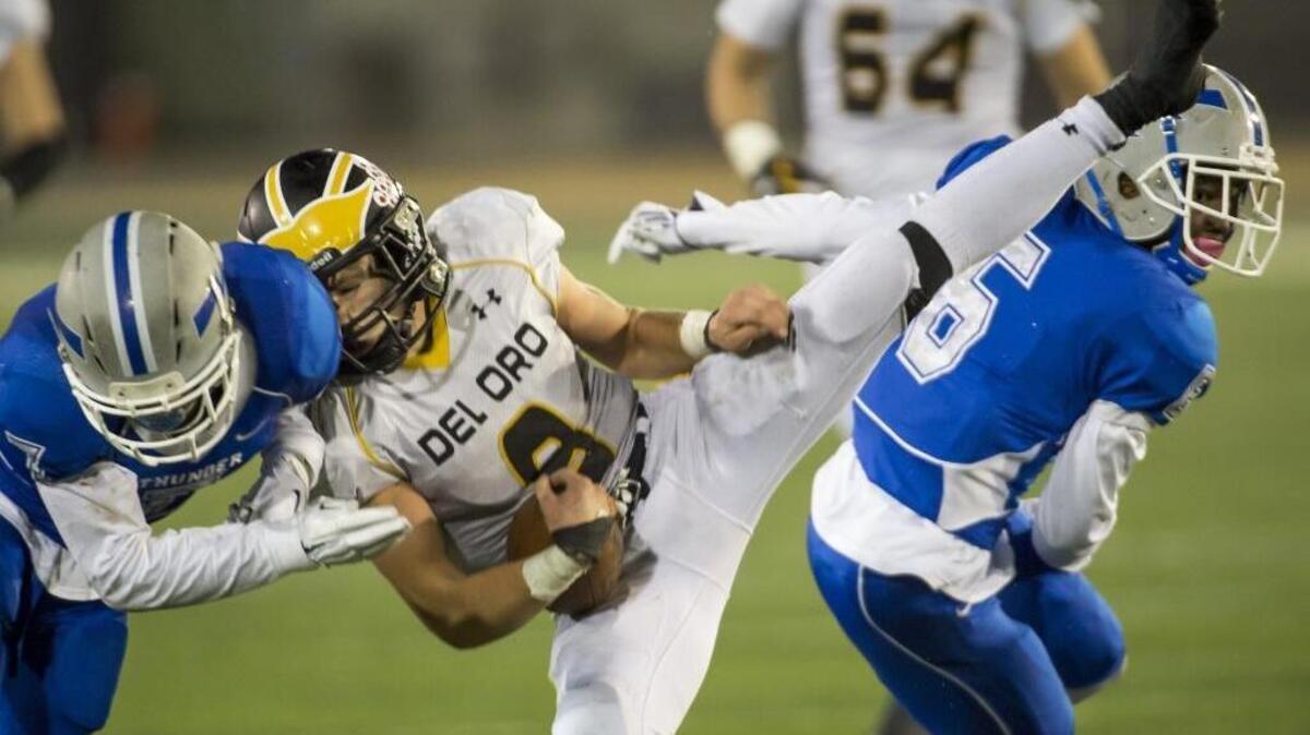 Del Oro Golden Eagle's Justin Burrage (9) comes down with a catch during the fourth quarter of the Division II Sac-Joaquin Section championship football game played at Sacramento State, Friday, December 4, 2015.