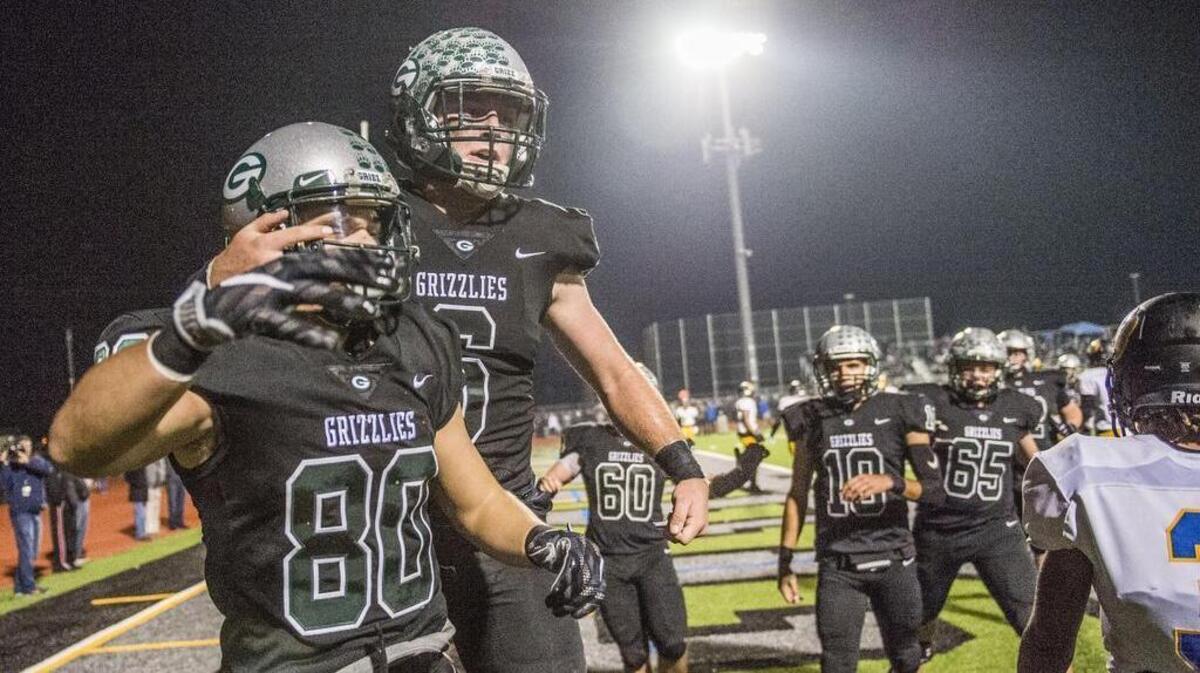 Granite Bay’s Matt Barron (80) celebrates his winning touchdown with teammate Evan Tattersall (6). The Grizzlies beat Del Campo 9-7 in Friday’s Sac-Joaquin Section Division II semifinal.