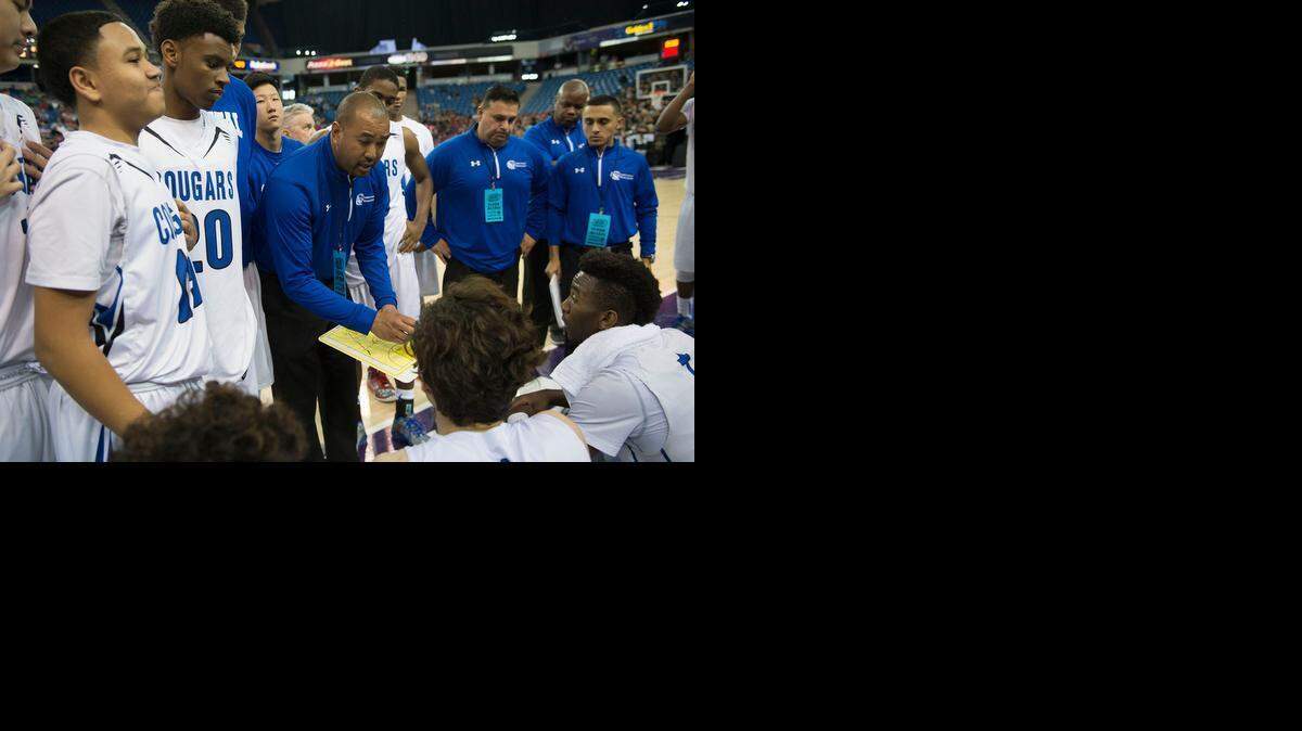 Capital Christian coach Devon Jones, center, says, “What we have are athletes who get along, who love to play <137>lay <137>together.”