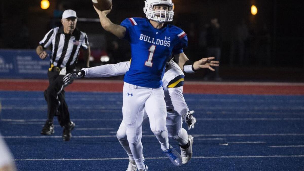Folsom High School Bulldogs Joe Curry (1), passes the ball during the first quarter as the Folsom High School Bulldogs varsity football team host the Oak Ridge High School Trojans, Friday, Nov. 4, 2016.