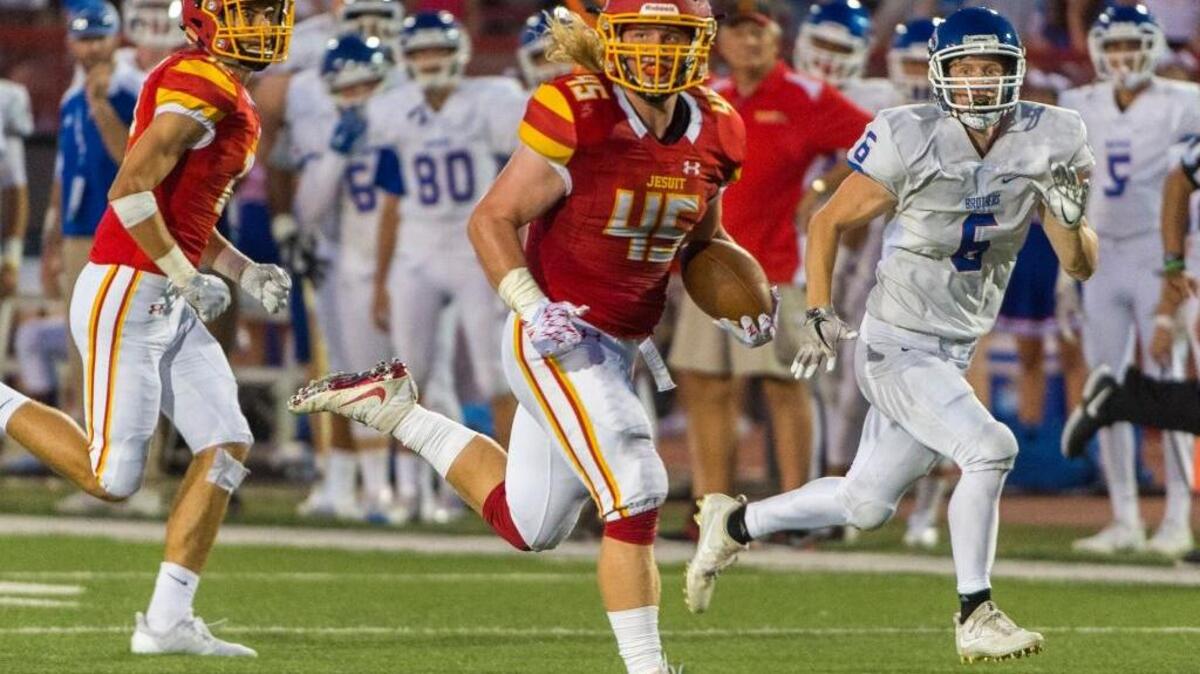 Jesuit Marauders’ Jason Gallagher (45) runs for a touchdown against Christian Brothers on Sept. 9. On Friday against Elk Grove, he led the defense in a 41-14 victory.