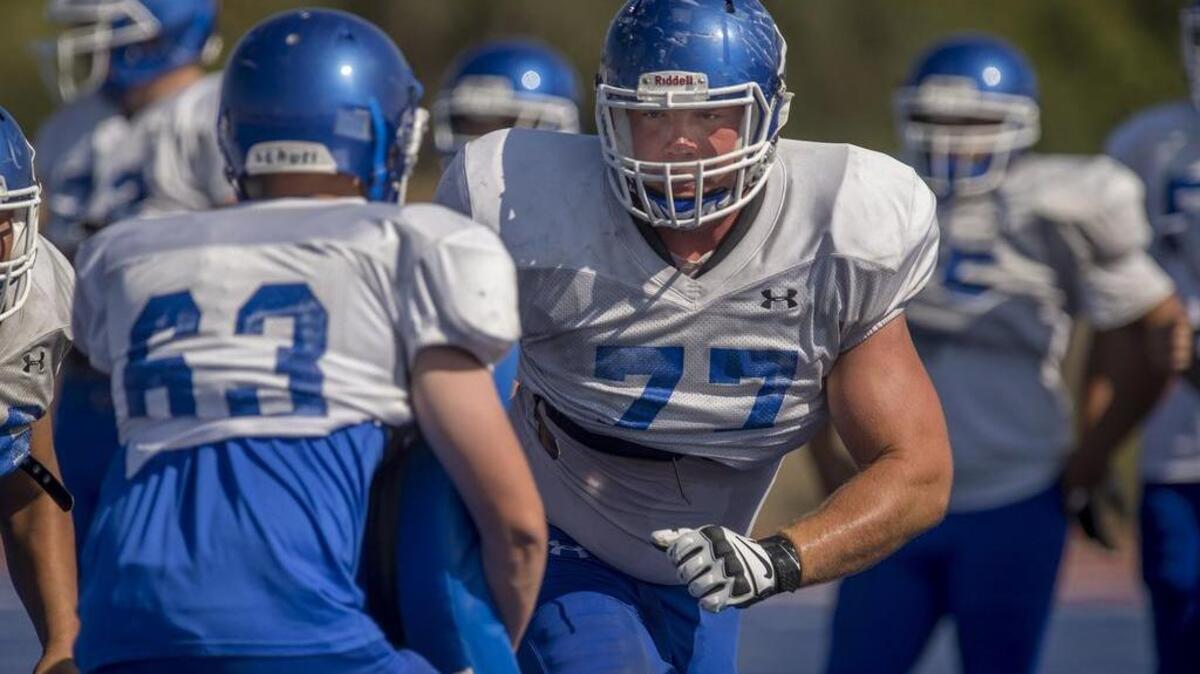 
National recruit lineman Jonah Williams, of the Folsom Bulldogs is expected to see a lot of action as the team is expected to run the ball far more often, Williams practices run blocking on Wednesday, August 19, 2015 in Folsom.
