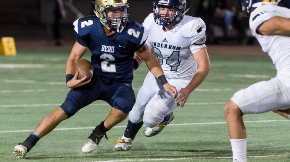 Elk Grove quarterback Jake Jordan (2), pictured running against Inderkum on Aug. 25, rushed for three touchdowns Friday night in the Thundering Herd’s win over Grant.