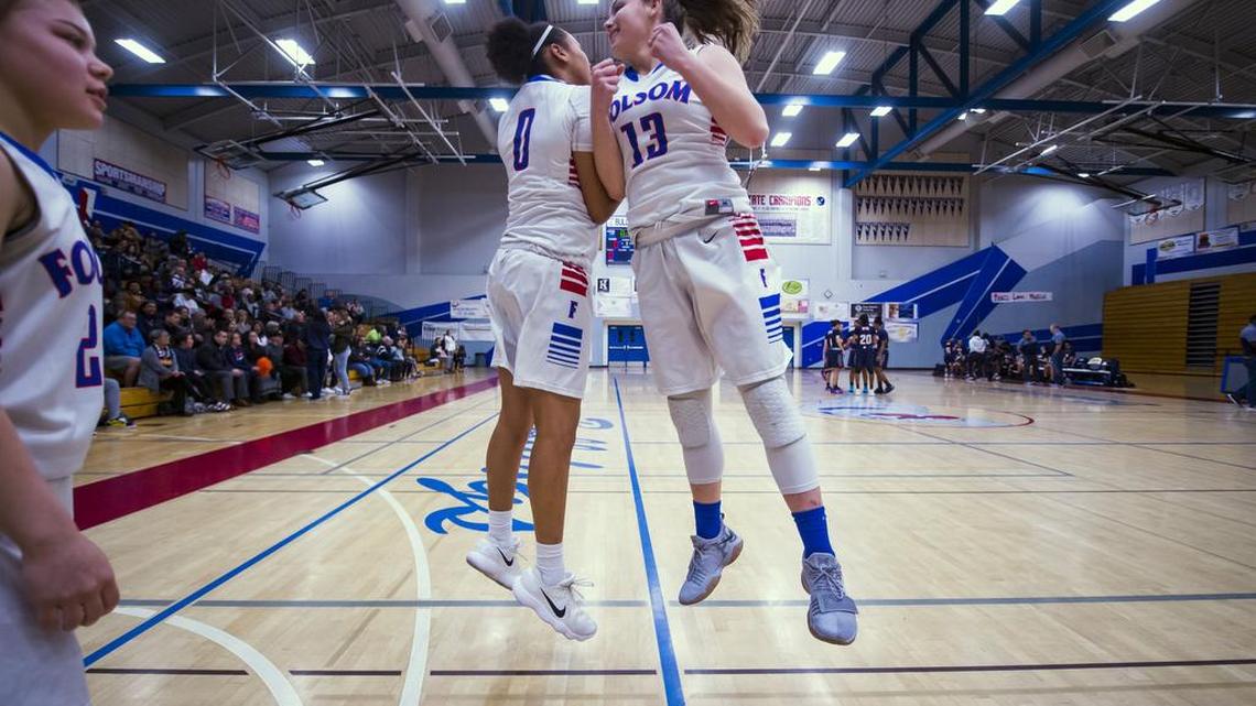 Folsom Bulldogs McKenzie Forbes (0) and Parker Gordon (13) are introduced before the game.