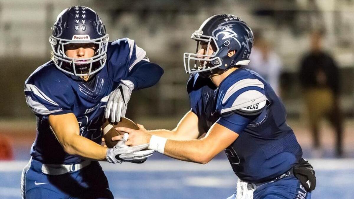 Vista del Lago running back Dominick Norris, left, takes the handoff from quarterback Brent Schaeffer against El Camino on Oct. 28. Norris led the Eagles to a 49-20 win over Cordova in a Sac-Joaquin Section Division III playoff opener on Thursday.