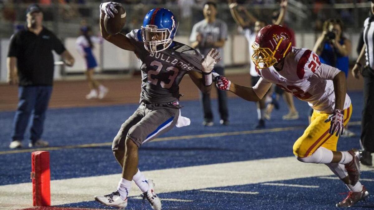 Folsom Bulldogs Brandon Rupchock (23) scores a touchdown during the third quarter.