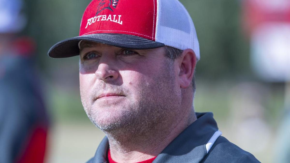 East Nicolaus Spartans head coach Travis Barker looks on the field during the game.