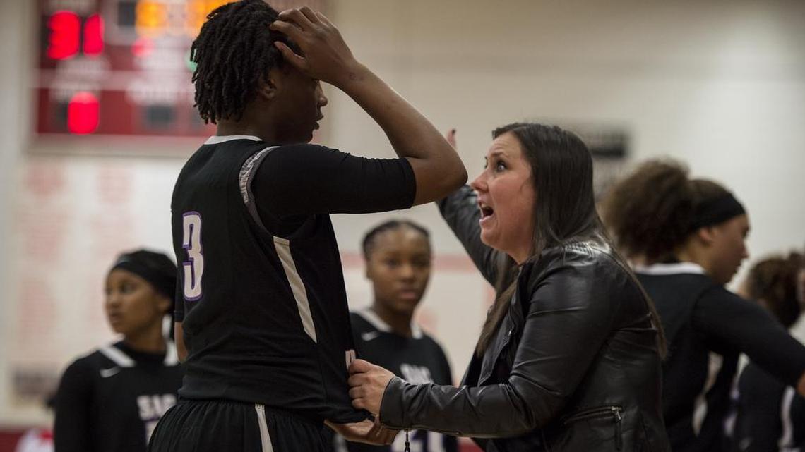 Sacramento coach Michele Massari, right, gives Andriana Avent (3) instruction during a game against McClatchy on Jan. 24, 2017. The Dragons, led by their 11th-year coach, are ranked No. 1 by The Bee this week and looking to win a Capital Athletic League championship before starting the Sac-Joaquin Section playoffs.