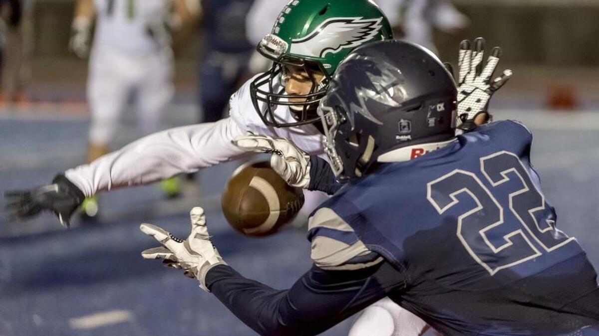 El Camino Eagles Zach Buick (4) knocks the pass away intended for Vista del Lago Eagles Brendan Pugh (22) during the first quarter as Vista del Lago plays El Camino at Folsom High School, Friday, October 28, 2016.
