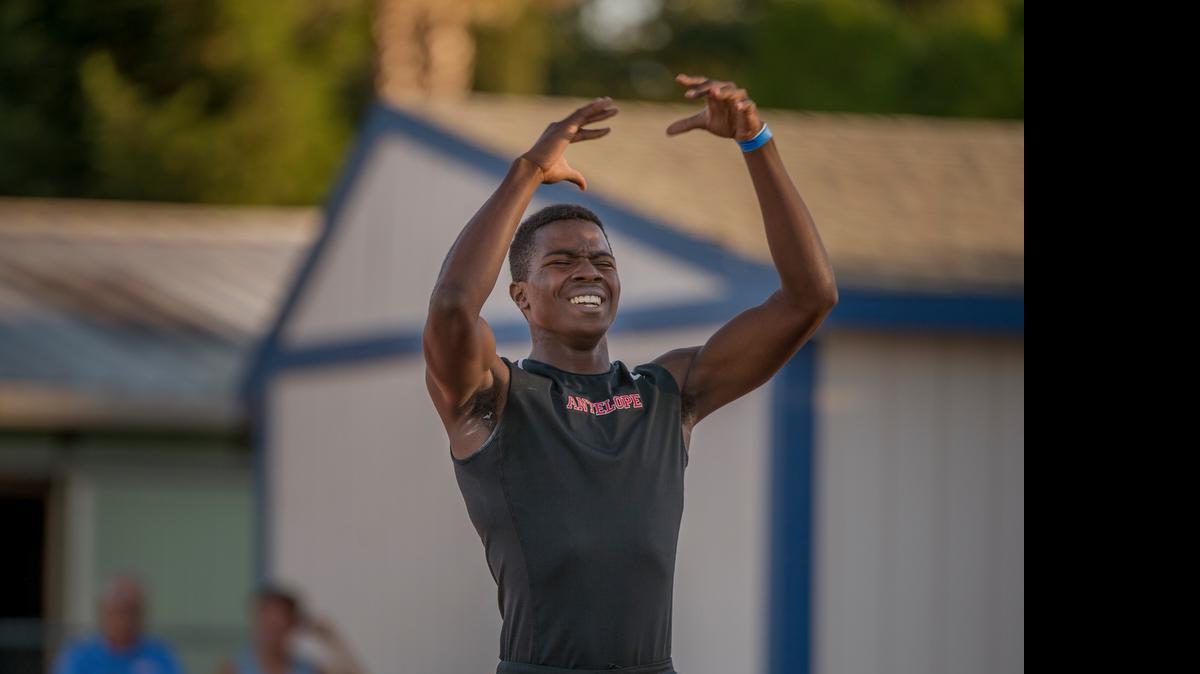 
Myles Ellis of Antelope High School celebrates after winning the 400 meters with a time of 47.47 seconds in the Masters Track and Field meet at Elk Grove High School on Friday, May 29, 2015.
