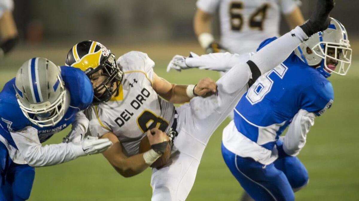 Del Oro Golden Eagles Justin Burrage (9), comes down with a catch during the fourth quarter of the Division II Sac-Joaquin Section championship football game played at Sacramento State, Friday, December 4, 2015.