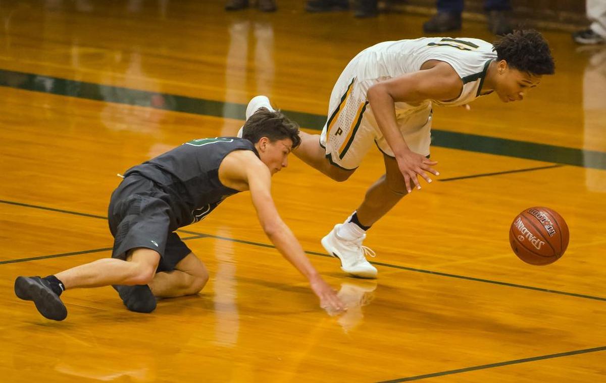 Placer Hillman Kai Huntsberry (10) steals the ball from Liberty Ranch Hawks Gabriel Nino (20).