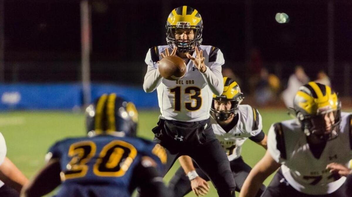 Del Oro’s Carson Jarratt takes a snap against Inderkum last Friday. The Golden Eagles upset the undefeated Tigers and now face Central Catholic of Modesto in a Sac-Joaquin Section semifinal tonight.