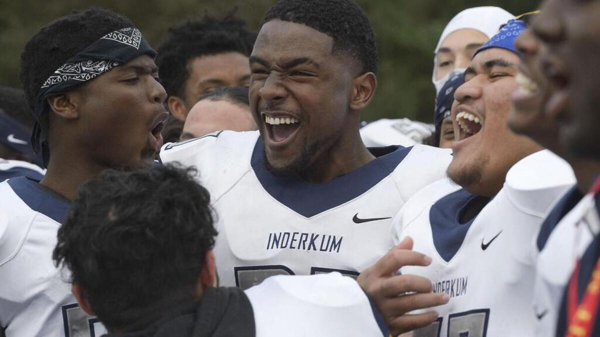 Inderkum Tigers players celebrate after winning their Sac-Joaquin Section Division II semifinal game against the Jesuit Marauders Jesuit in Carmichael on Saturday, November 26, 2016. The Inderkum Tigers won the game 52-35.