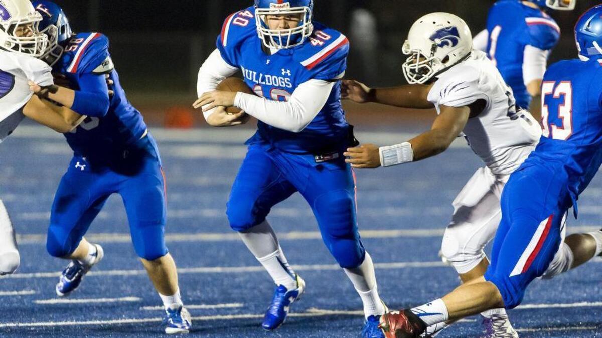 Folsom Bulldogs Hayden Hughes (40), runs with the ball during the third quarter as the Folsom High School Bulldogs host the Franklin High School Wildcats in the Sac-Joaquin Section/Les Schwab Tires Division II second round playoff game, Friday Nov 20, 2015.