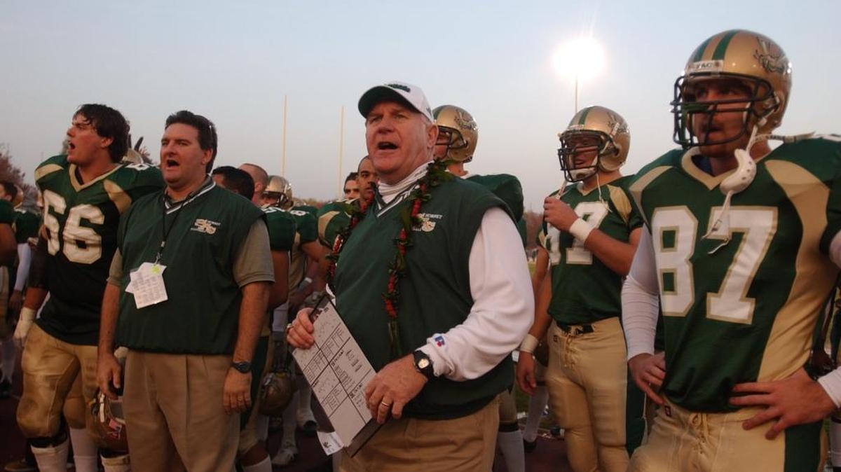 Former Sacramento State football coach John Volek, center, is shown here following a Hornets victory over Humboldt State on Saturday, Nov. 23, 2002.
