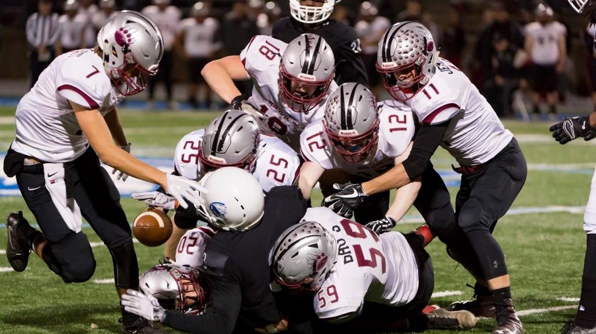 Bear River’s defense swarms Capital Christian’s Maurice Gaines during Thursday’s Sac-Joaquin Section Division V opener. No. 6 Bear River upset No. 3 Capital Christian 26-7.