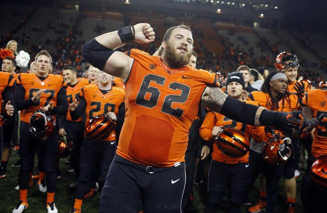 Oregon State offensive guard Gavin Andrews (62) leads the Beavers in singing the fight song after the team's 42-17 win over Arizona in an NCAA college football game in Corvallis, Ore., Saturday Nov. 19, 2016.