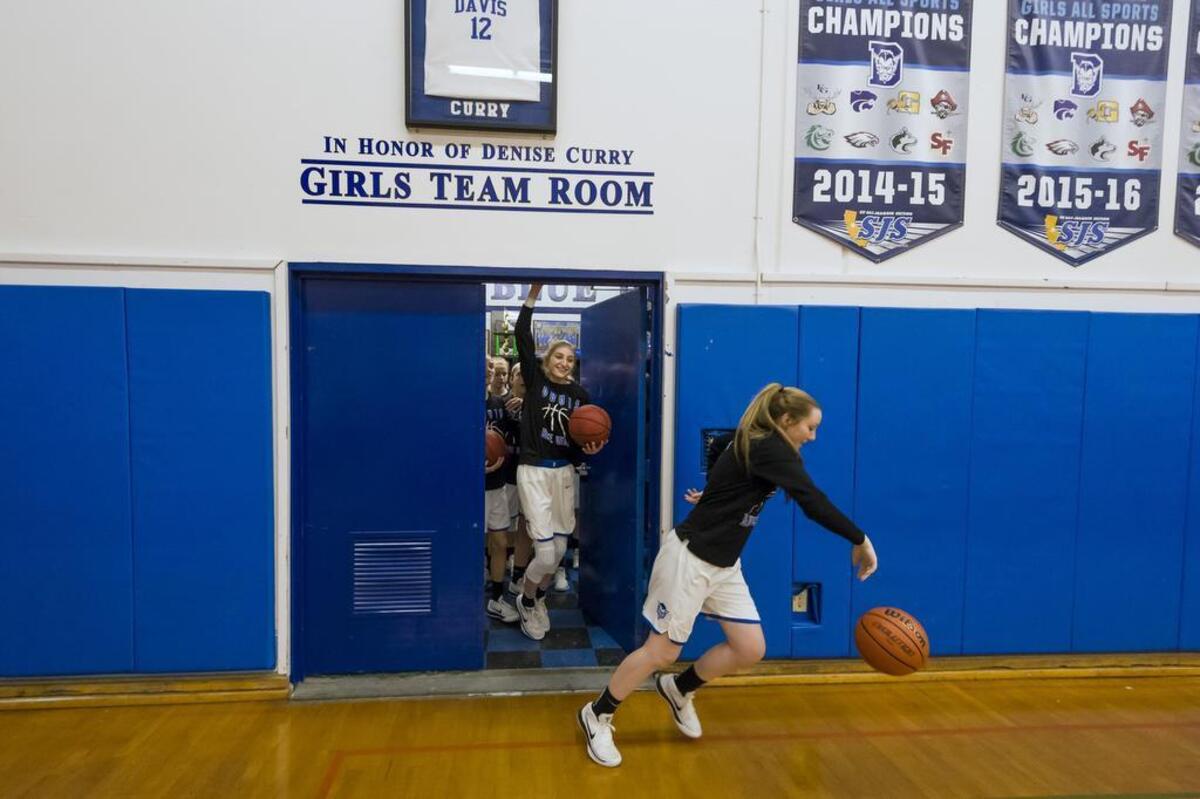 The Davis High School Lady Blue Devils come out of the locker room before the game as they host the Sheldon Huskies on Wednesday.