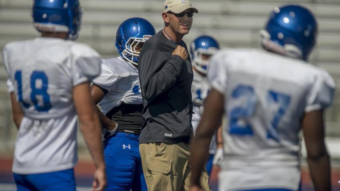 
Folsom co-coach Troy Taylor works with the offense during a football practice on Wednesday, August 19, 2015 in Folsom. The former Cal quarterback was happy to see Jared Goff break his school record for passing yards during the Bears’ 45-44 win at Texas on Saturday, Sept. 19, 2015.
