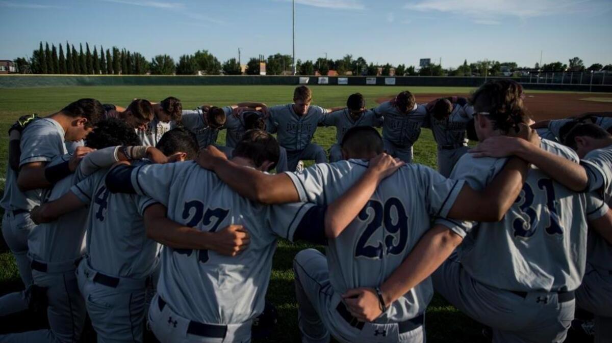 The Elk Grove High baseball team huddle up during a Sac-Joaquin Section playoff game last year. The Thundering Herd is seeking a third consecutive section banner this season.