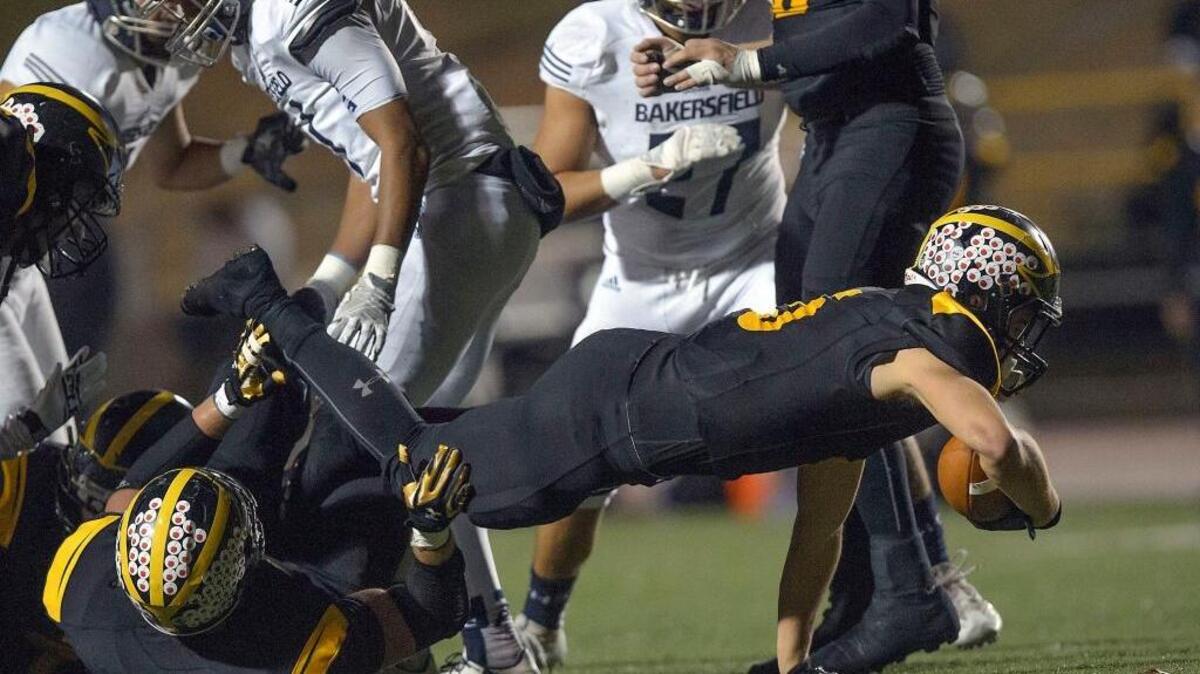 Del Oro’s Dalton Gee dives for extra yardage in Saturday’s 57-16 win over Bakersfield in Loomis.