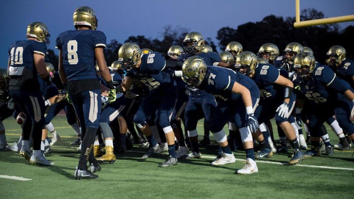 Elk Grove players get pumped at a game between the Thundering Herd and Grant on Friday, Sept. 30, at Elk Grove High School. Elk Grove plays at Folsom on Friday in a Sac-Joaquin Section Division I semifinal.
