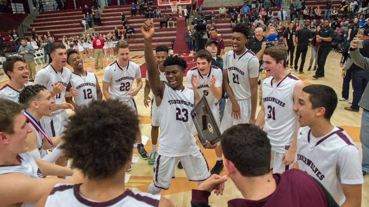 The Woodcreek High boys basketball team celebrates their CIF Northern California Open Division title-game win over Sheldon on March 18 in Santa Clara. The Timberwolves top The Bee’s final boys rankings.
