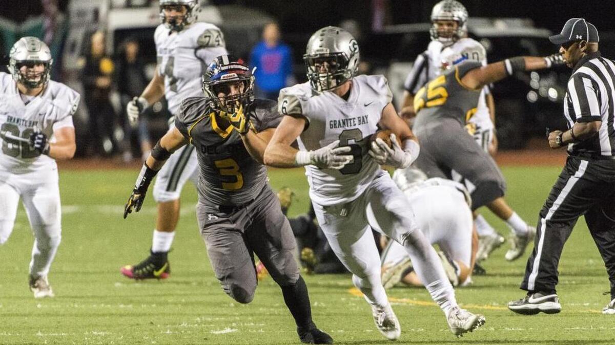 Granite Bay fullback Evan Tattersall (6) runs with the ball during the second quarter against Del Oro on Friday.