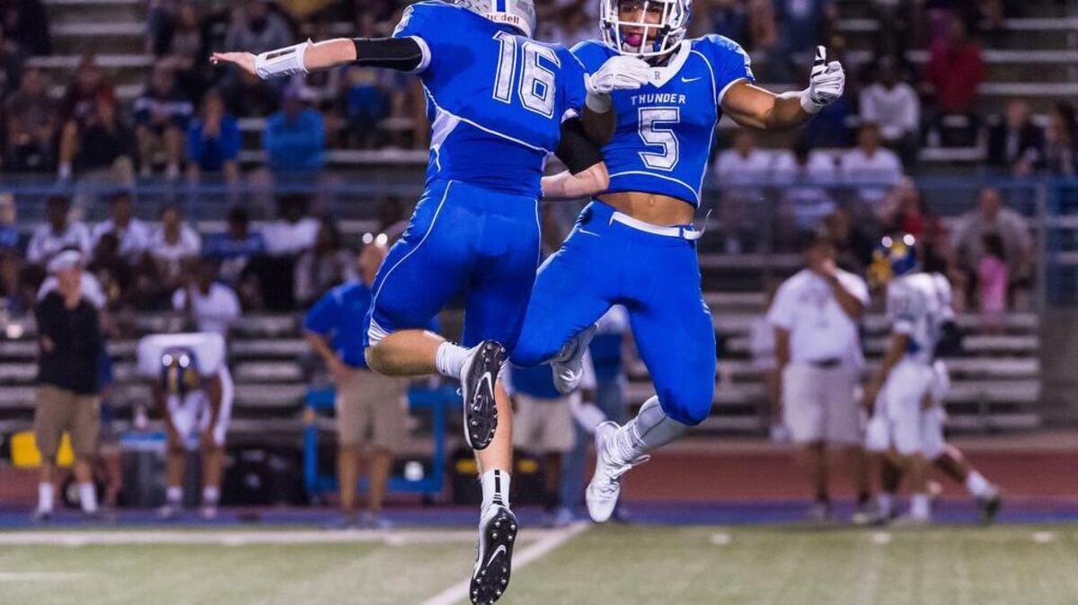 Rocklin’s William Floyd (16) celebrates with Evyn Holtz after Holtz’s kickoff return for a touchdown against visiting Del Campo on Sept. 4, 2015.