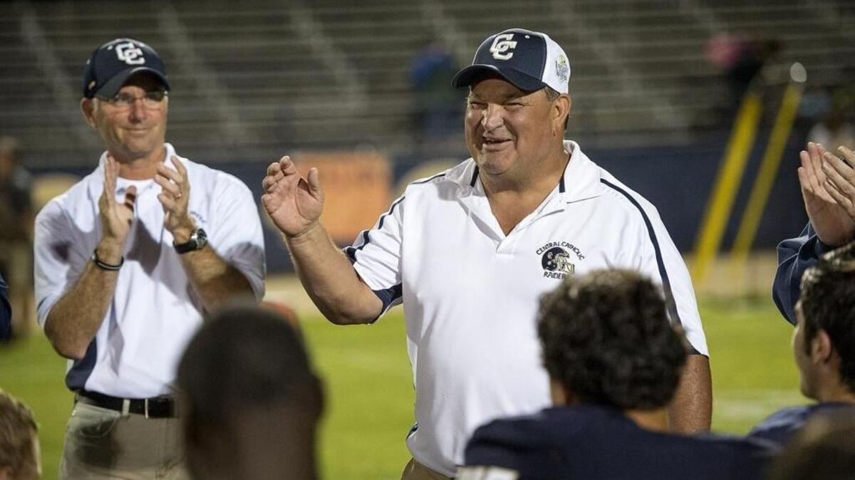 Central Catholic coach Roger Canepa talks to his team after his 200th career victory, against Atwater in Modesto, Calif., on Friday, Sept. 4, 2015. Central Catholic won the game 49-0.