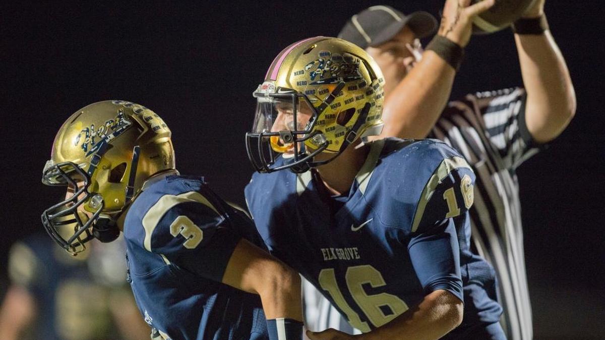 
Elk Grove quarterback Jayden Machado (16) congratulates wide receiver Jonas McMillan (3) after they connected on a 42-yard touchdown pass in the third quarter of the Thundering Herd’s 63-14 victory over Jesuit on Friday, Oct. 9, in Elk Grove.
