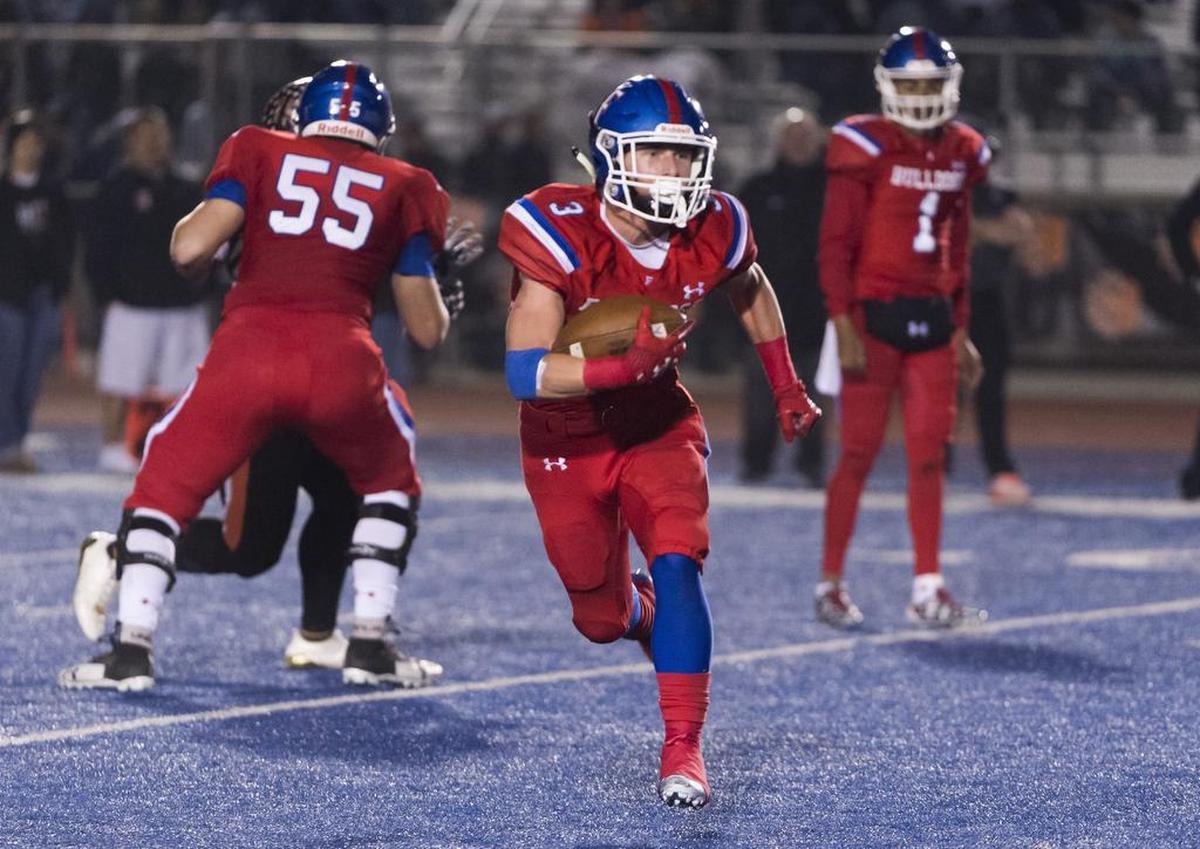 Folsom Bulldogs Cj Hutton (3), runs with the ball during the third quarter as the Folsom High School Bulldogs varsity football team hosts the Central High School Grizzlies in the CIF NorCal Division I-AA title game, Friday Dec 8, 2017. The winner of this game will face the CIF SoCal winner in the State Championship game at Sacramento State, Friday Dec 15th.