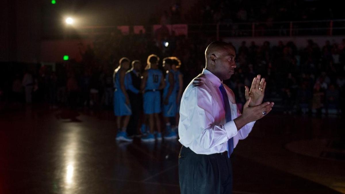 Burbank High School boys basketball coach Lindsey Ferrell has the Titans in a Sac-Joaquin Section semifinal for the first time in 19 years. ... Ferrell applauds during player introductions before a high school basketball game, Friday, Feb. 10, 2017 against Sacramento High.