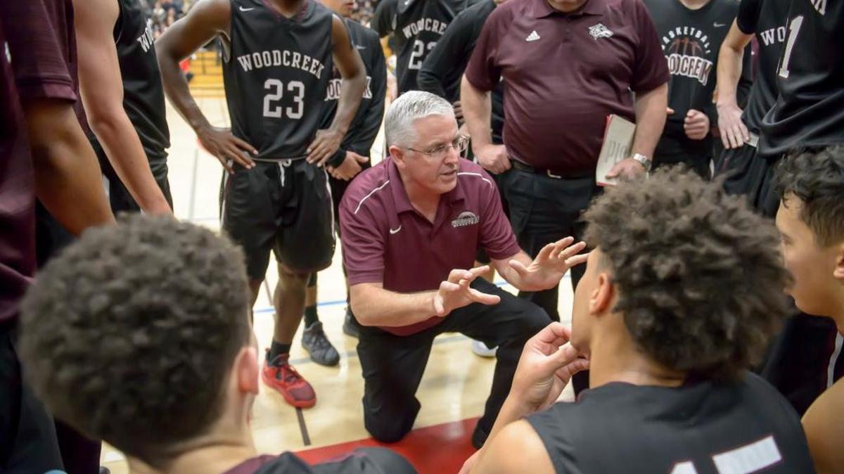 Woodcreek High boys basketball coach Paul Hayes talks to his team during a game against Folsom on Jan 20.