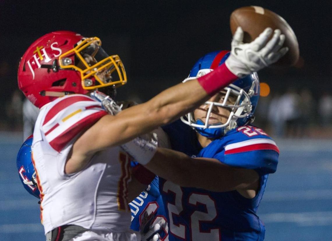 Folsom’s Tanner Ward (22) fights for a pass intended for Jesuit’s Josh Farr during a Sac-Joaquin Section Division I third-round playoff game Nov. 24, 2017. Farr is walking on at Nevada, Ward at Sacramento State.