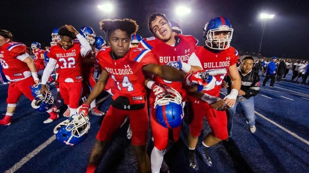 The Folsom High football team celebrates its win over Central of Fresno in the CIF NorCal Division I-AA title game Friday. The Bulldogs wil face Helix of La Mesa for the CIF State title Friday night at Sacramento State.