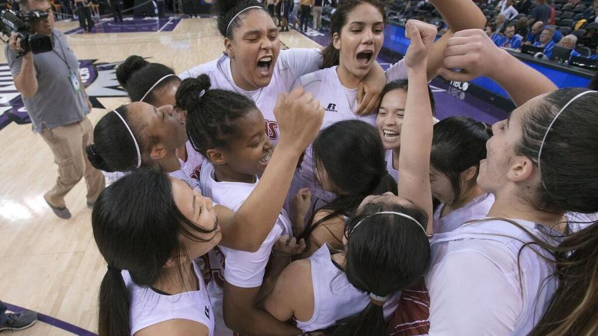 The McClatchy Lions celebrate their victory following the girls Division I NorCal Championship game between McClatchy and Oak Ridge at Sleep Train Arena in Sacramento on Saturday, March 21, 2015. McClatchy won the game 58-49.