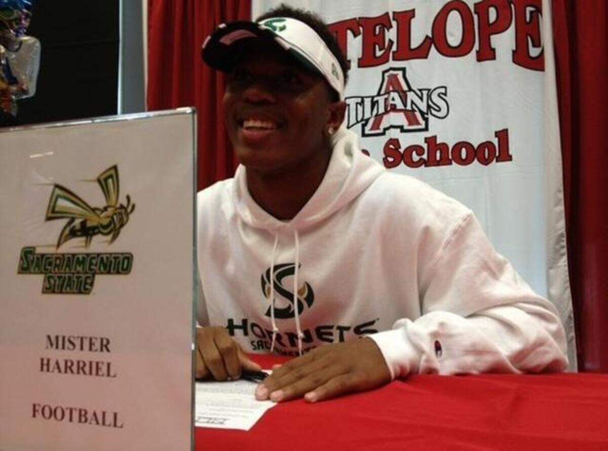 
Mister Harriel, the gifted two-way star from Antelope High School, smiles after signing his letter of intent to attend Sacramento State.
