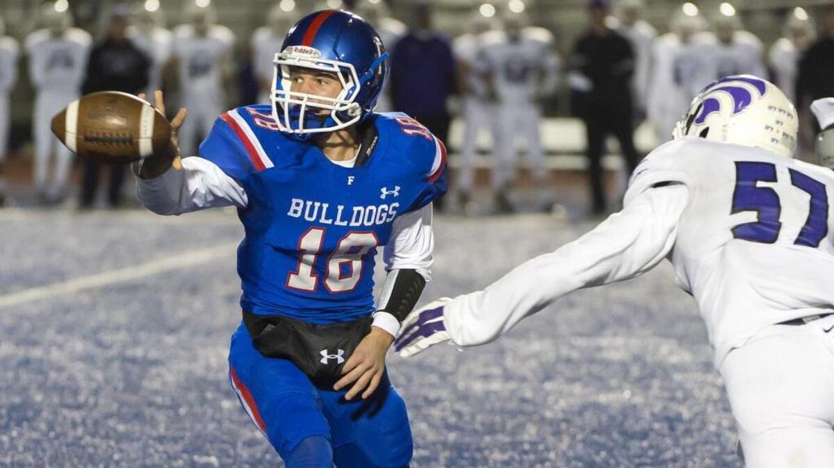 Folsom’s Jake Jeffrey tosses the ball during the second quarter as the Folsom High School Bulldogs host the Franklin High School Wildcats in the second round of a Sac-Joaquin Section Division II playoff game on Friday, Nov. 20, 2015.