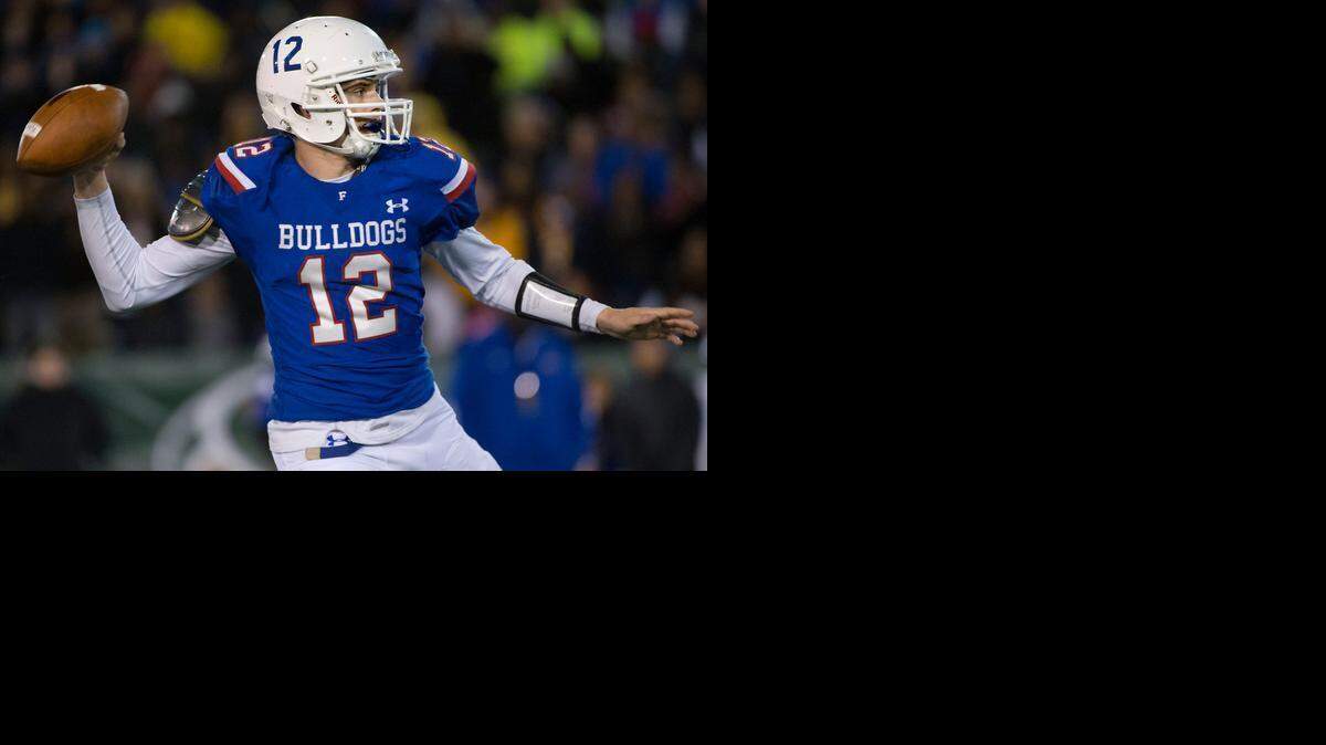 
Folsom High School quarterback Jake Browning (12) passes against Grant during the CIF Northern California Regional Division I championship game on Dec. 12, 2014, at Sacramento State’s Hornet Stadium.

